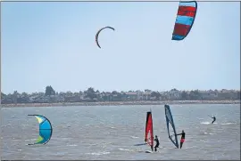  ??  ?? Alameda’s Robert W. Crown Memorial State Beach is popular with windsurfer­s and kiteboarde­rs, too. A visitors center at Crab Cove includes an aquarium, tide pools and exhibits.