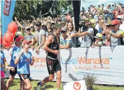  ?? PHOTO: STEPHEN JAQUIERY ?? Big cheer . . . A large crowd on the Wanaka lakefront cheers as Christchur­ch’s Dylan McNeice wins the 2015 event.