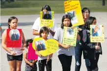  ?? DARREN MAKOWICHUK ?? Family and friends of Darrell Kevin Smith hold a peaceful protest in front of the Office of the Chief Medical Examiner on Bowness Road N.W. on Thursday.