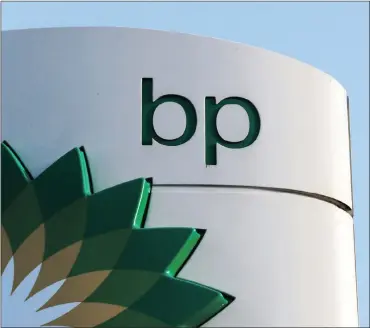  ?? PHOTO: REUTERS ?? A BP logo at a petrol station in London. The company has gone on a spending spree in recent months.