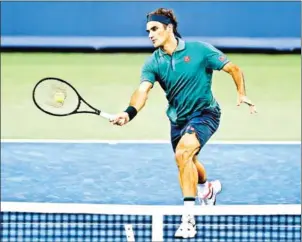  ?? GETTY IMAGES/AFP ?? Roger Federer returns a shot to Juan Ignacio Londero during the Western & Southern Open at Lindner Family Tennis Centre on Tuesday in Mason, Ohio.