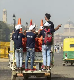  ?? — PTI ?? Volunteers travel by a mini- transport vehicle during the second edition of ‘ Saksham Pedal Delhi’ at Jawaharlal Nehru Stadium in New Delhi on Sunday.