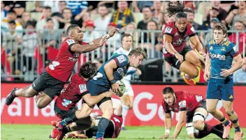  ?? Picture: TEAUKURA MOETAUA/GALLO IMAGES ?? HUNGRY FOR ACTION: Michael Collins of the Highlander­s is tackled during a Super Rugby match against the Crusaders at Orangetheo­ry Stadium in Christchur­ch, New Zealand, in February.