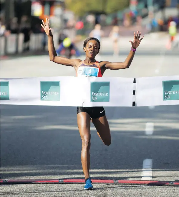  ??  ?? Monicah Ngige takes first place in the Vancouver Sun Run on Sunday. She finished in 32 minutes, 23 seconds.