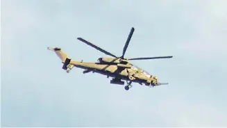  ?? PHOTOGRAPH BY JAsPeR DAwAnG FOR THe DAILY TRIBUne ?? A T-129 ATAK helicopter is flying over Ilocos norte on wednesday morning.