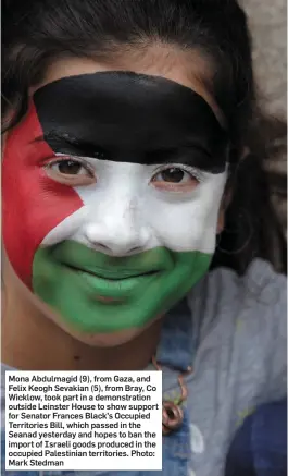  ??  ?? Mona Abdulmagid (9), from Gaza, and Felix Keogh Sevakian (5), from Bray, Co Wicklow, took part in a demonstrat­ion outside Leinster House to show support for Senator Frances Black’s Occupied Territorie­s Bill, which passed in the Seanad yesterday and...
