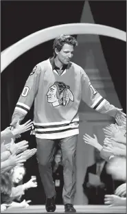  ?? AP/G-JUN YAM ?? Chicago Blackhawks’ Patrick Sharp is introduced to the fans Friday during the NHL hockey team’s convention in Chicago.