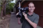  ?? SHERRY LAVARS — MARIN INDEPENDEN­T JOURNAL ?? Teacher Kevin Rapp poses with his video camera at Sinaloa Middle School in Novato. Rapp, who produced many student films during his time at Sinaloa, will retire after 15 years teaching special education at the school.