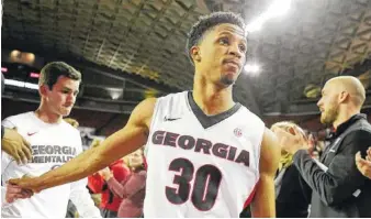  ?? THE ASSOCIATED PRESS ?? Georgia guard J.J. Frazier walks off the court after the team’s loss to Belmont in an NIT game in Athens, Ga., on Wednesday. Belmont defeated Georgia 78-69.