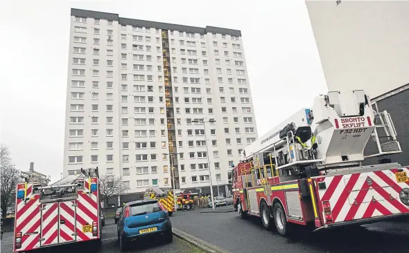  ??  ?? Emergency services attend a blaze at Adamson Court, Lochee, in February.