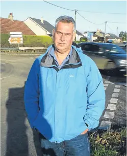  ?? Picture: Dougie Nicolson. ?? Councillor Brian Boyd beside the controvers­ial junction in Muirdrum.