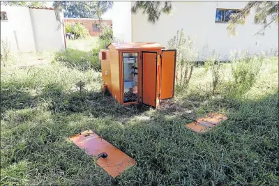  ?? Pictures: ALAN EASON ?? PICTURE OF DESOLATION: A stripped electricit­y box amid overgrown grass and weeds at the closed Fort Grey TB Hospital