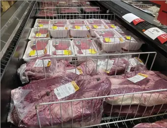  ?? AP FILE ?? CHEW ON THIS: Beef is seen at a supermarke­t. Prices for meat and other groceries have also rocketed upward.