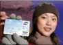  ?? XU HAIFENG / FOR CHINA DAILY ?? A Chinese traveler shows her credit card jointly issued by the Shanghai Pudong Developmen­t Bank and Citibank.