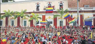  ?? AP ?? Venezuela's President Nicolas Maduro speaks to his supporters from a balcony at the Miraflores presidenti­al palace during a recent rally in Caracas, Venezuela.