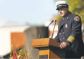  ??  ?? Santa Rosa Fire Chief Tony Gossner speaks at the event held at Santa Rosa Junior College. People remembered those killed and thanked the fire crews and other first responders.