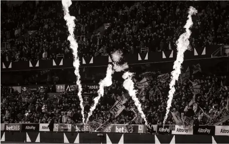  ?? Getty ?? Pyrotechni­cs during a Premier League match. England’s club football was a pioneer of the rules that are now followed globally