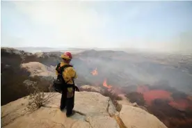  ?? Photograph: David Swanson/Reuters ?? The Fairview fire, near Hemet, California, is one of several big blazes being fought across the state.