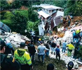  ?? (AFP) ?? TRAGEDIA. Varias casas del barrio Los Andes quedaron sepultadas.