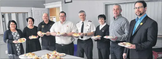  ?? SUBMITTED PHOTO ?? The NLCU’S team in Grand Falls-windsor supported the Society Saint-vincent De Paul by volunteeri­ng to cook and serve meals for their monthly community luncheons.