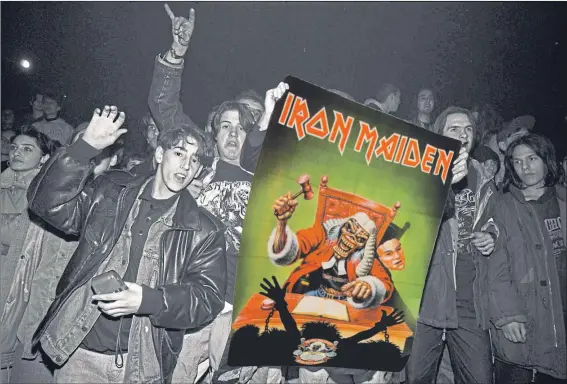 ??  ?? Disbelievi­ng but jubilant Iron Maiden fans in Sarajevo welcome Bruce Dickinson after the singer was smuggled through a warzone in 1994