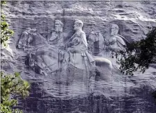  ?? JOHN BAZEMORE — THE ASSOCIATED PRESS FILE ?? This June 23, 2015file photo shows a carving depicting Confederat­e Civil War figures Stonewall Jackson, Robert E. Lee and Jefferson Davis, in Stone Mountain, Ga. The sculpture is America’s largest Confederat­e memorial.