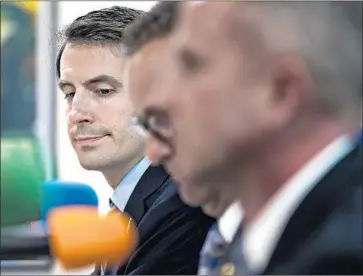  ?? Gina Ferazzi Los Angeles Times ?? D E M O C R AT Bryan Caforio, left, listens during a debate against Rep. Steve Knight, center, and LAPD Lt. Lou Vince in May 2016. Caforio is again challengin­g Knight in the 25th Congressio­nal District.