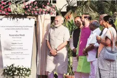  ?? PHOTO: PTI ?? Prime Minister Narendra Modi with Gujarat Chief Minister Vijay Rupani and Union Human Resource Developmen­t Minister Prakash Javadekar at the inaugurati­on of IIT-Gandhinaga­r’s new campus on Saturday