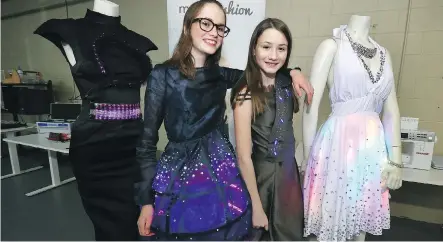  ?? PHOTOS: JIM WELLS ?? Ashley Voisin and her sister Lauren pose with some of the wearable-technology creations at a warehouse in Radisson Heights where first-time hobbyists, experience­d robotics engineers and high-tech fashion designers can all rent space or pop in for a day...