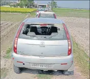  ?? SAMEER SEHGAL/HT ?? The injured woman lying on a cot outside her house; (right) a car that was damaged during the attack by the sand mafia henchmen at Abadi Sohan Singh Ballarwarh village in ■ Amritsar district on Friday.