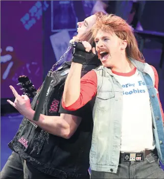  ??  ?? CONNECTION: Dylan Shalless, playing Drew, left, and Chris Versteegen, Lonny, steal the spotlight in Horsham Arts Council’s production of Rock of Ages.
Picture: PAUL CARRACHER