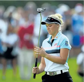  ?? SEAN KILPATRICK/THE CANADIAN PRESS ?? Brooke Henderson reacts to her putt on the 7th hole during the final round of the 2017 CP Women’s Open, in Ottawa, on Sunday.