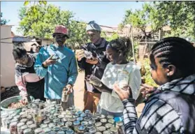  ?? ?? In our hands: People who come to the centre are given seeds, seedlings, compost and gardening tools to start food gardens.