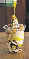  ??  ?? Fior di latte soft serve is topped with chocolatea­maro sauce, candied hazelnuts and olive oil.