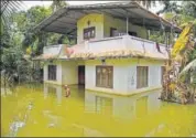  ?? AP ?? A man wades through water after arriving to inspect his flood affected house in Kuttanad, Alappuzha, in Kerala on Monday.