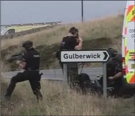 ??  ?? On alert: Armed officers take up position as Barlow roams the island