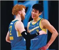  ??  ?? Guards Nico Mannion, left, and Jeremy Lin converse during the Santa Cruz Warriors’ win over Austin in the teams’ NBA G League game at AdventHeal­th Arena in Orlando.