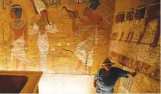  ?? (Mohamed Abd El Ghany/Reuters) ?? FORMER TOURISM MINISTER Zahi Hawass explains paintings on the newly renovated tomb wall of King Tutankhamu­n in the Valley of the Kings in Luxor, Egypt, in October.