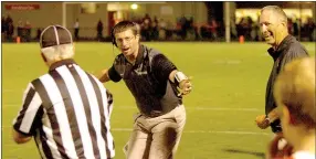  ?? MARK HUMPHREY ENTERPRISE-LEADER ?? Football intensity runs in the family. Farmington offensive coordinato­r Spencer Adams, son of head football coach Mike Adams (right) asks an official why no flag was thrown after a Cardinal ball carrier was brought down by his face mask during a 5A...