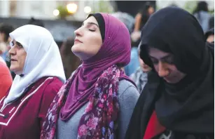  ?? (Amr Alfiky/Reuters) ?? LINDA SARSOUR prepares to pray during an immigratio­n rally in New York during Ramadan. Sarsour believes that ‘the birthplace of Jesus is under military occupation.’