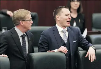  ?? IAN KUCERAK/FILES ?? Education Minister David Eggen, left, and Economic Developmen­t and Trade Minister Deron Bilous josh the opposite bench before Finance Minister Joe Ceci delivered the budget on March 22.