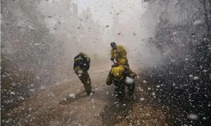  ??  ?? The Australian government has continued to maintain there is no concrete evidence of a link between the chemicals used in firefighti­ng foam and adverse health impacts. Photograph: Guillermo Salgado/AFP/Getty Images