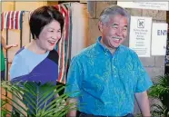  ?? CALEB JONES/AP PHOTO ?? Hawaii Gov. David Ige, right, and first lady Dawn Amano Ige smile Wednesday after voting early in the state’s primary election in Honolulu. Ige is seeking the nomination for a second term in office in Saturday’s Democratic primary. He is being challenged by U.S. Rep. Colleen Hanabusa, who is giving up her seat in Congress to challenge the governor.