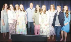  ?? (NWA Democrat-Gazette/Carin Schoppmeye­r) ?? The staff at Saving Grace welcome supporters to the 15th annual Butterflie­s & Blooms benefit luncheon March 28 at the Rogers Convention Center. They are: Katie Mercer (from left), Jennifer Watson, Lauren Vega, Kamber Henson, Kent and Becky Shaffer, Abigail Harris, Wendi Snider-Seidel, Hayden Shaffer and Anna Sheridan.