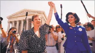  ?? J. Scott Applewhite / Associated Press ?? In this April 26, 1989 file photo, Norma McCorvey, Jane Roe in the 1973 court case, left, and her attorney Gloria Allred hold hands as they leave the Supreme Court building in Washington after sitting in while the court listened to arguments in a Missouri abortion case.