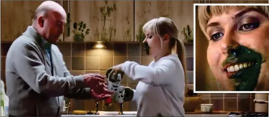  ??  ?? PROPAGANDA: The man takes a cup of tea from his granddaugh­ter who has virus-smeared hands and face in the Scottish Government’s warning film