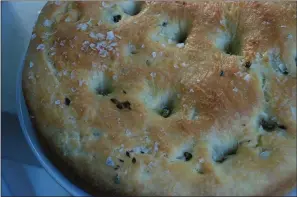  ??  ?? A green olive and thyme focaccia.