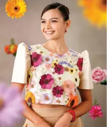  ?? CONTRIBUTE­D PHOTOS ?? Event host and reigning Miss Supranatio­nal Philippine­s Pauline Amelinckx dazzles in a cropped terno top with bright floral appliques which reflects her radiant personalit­y.