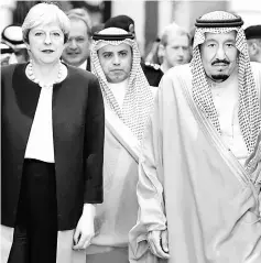  ??  ?? A handout picture provided by the Saudi Royal Palace shows Saudi King Salman (right) meeting with Theresa May in Riyadh. — AFP photo