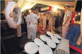  ?? Jaime Puebla / The National ?? A naval officer comes aboard the PNS Khaibar at a reception organised by the Pakistan Embassy on behalf of the ship’s commanding officers at Port Rashid in Dubai on Thursday.